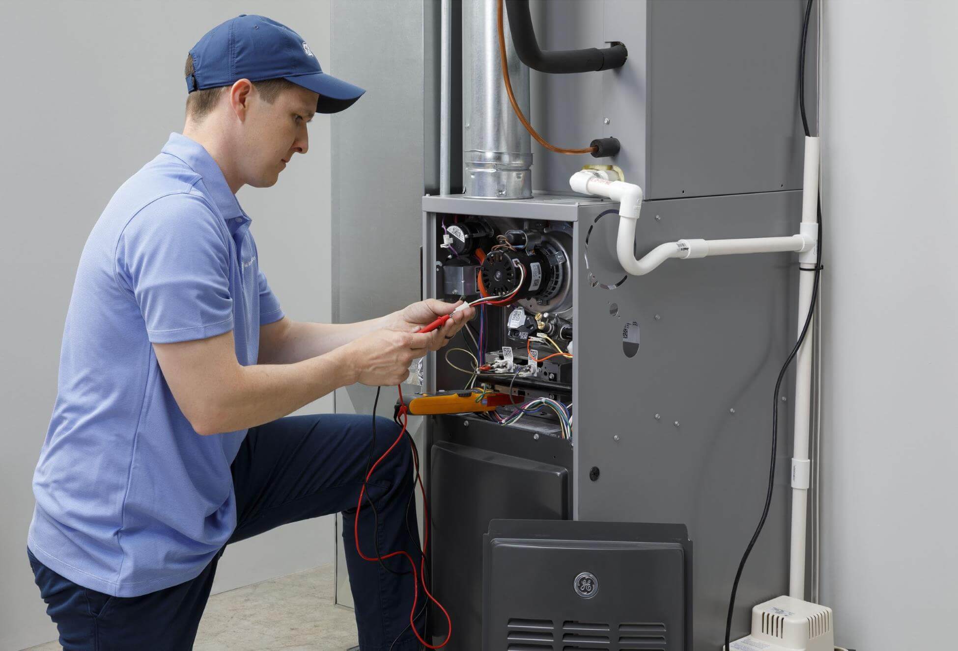 technician servicing furnace