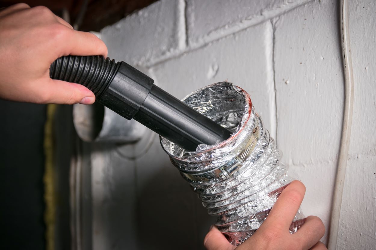HVAC Tech cleaning ventilation